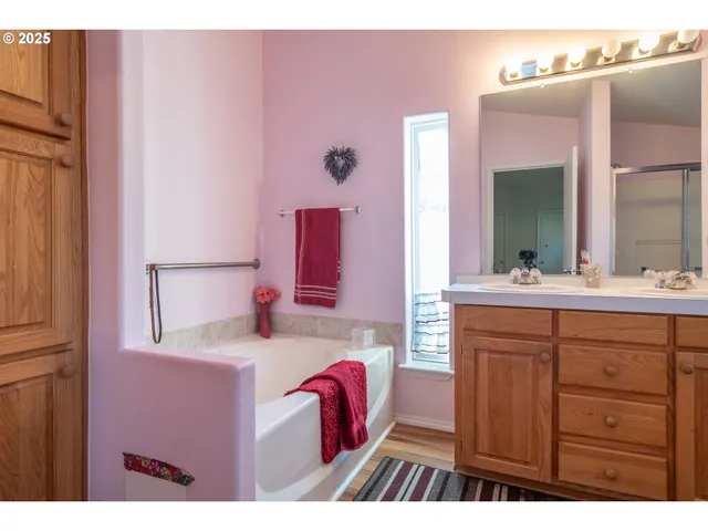 a bathroom with a sink vanity and a mirror