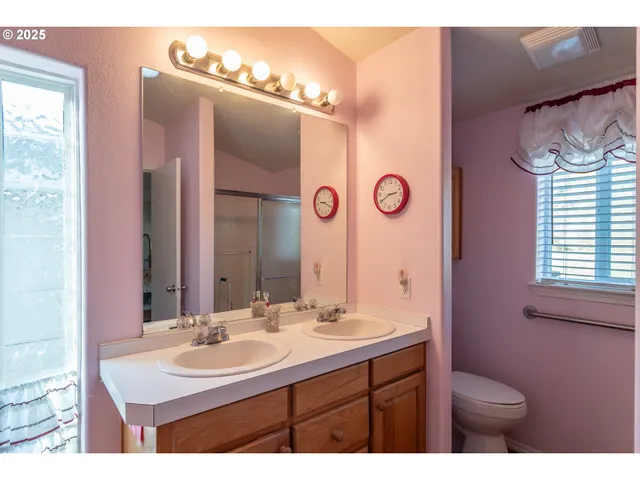 a bathroom with a mirror and a shower