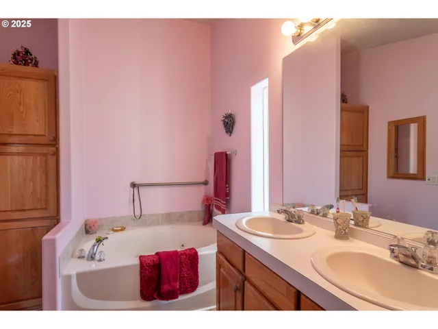 a bedroom with a bed and a night stand