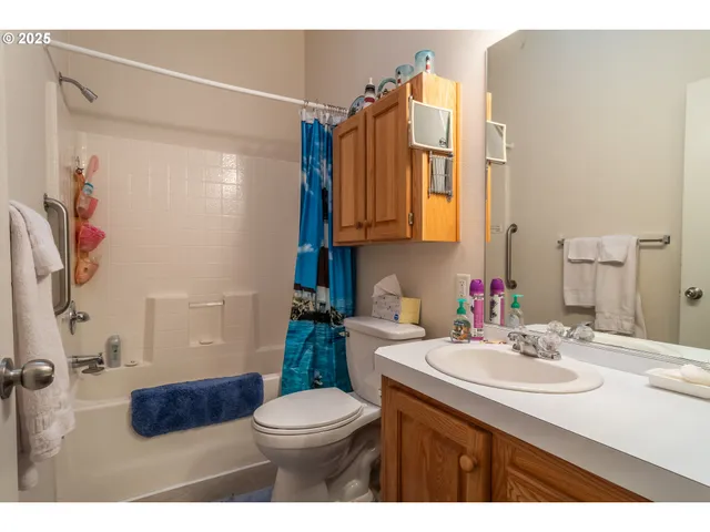 a living room with lots of furniture and a chandelier