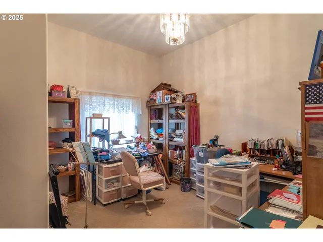 a utility room with cabinets washer and dryer