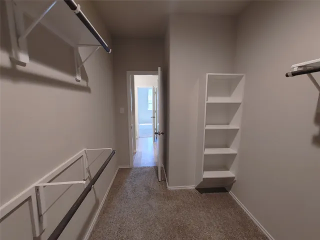 a view of room with window and closet