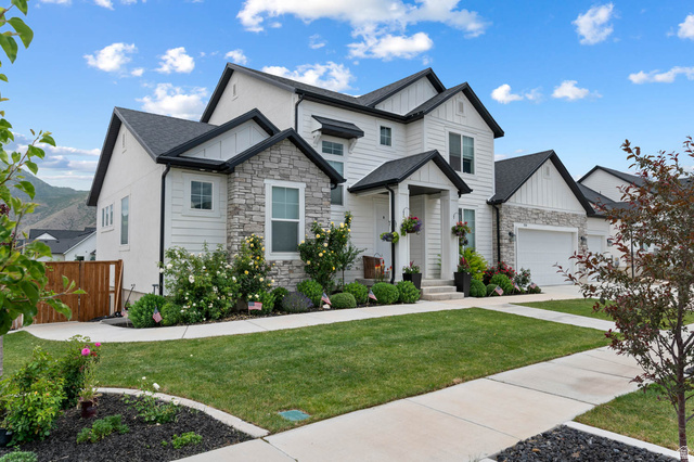 500 North 516th Street West, Unit 19 Mapleton, UT 84664 - Photo 1 of 41 Modern Farmhouse-style featuring white siding, stone accents, and dark trim details