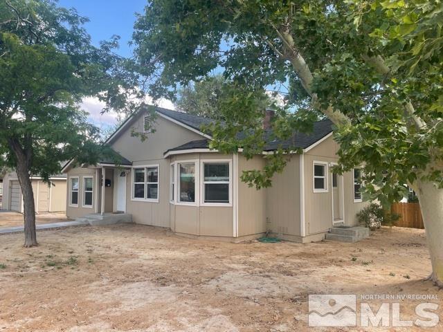 690 Cleveland Avenue Reno, NV 89503 - Photo 1 of 15 a front view of a house with a garden