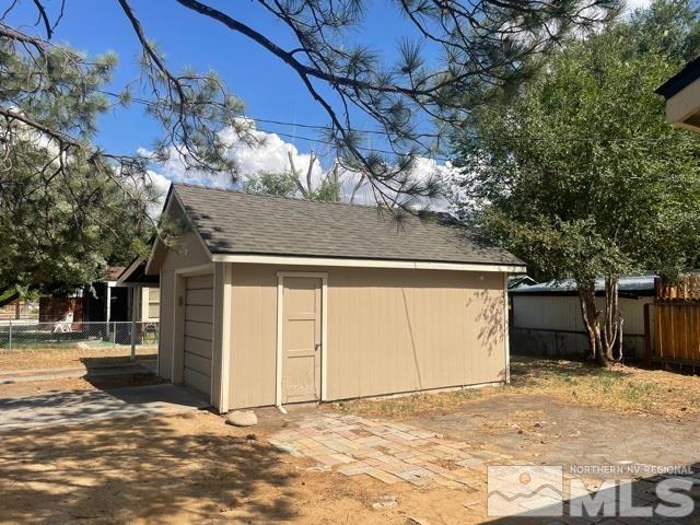 690 Cleveland Avenue Reno, NV 89503 - Photo 14 of 15 a view of garage with a tree