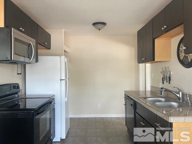 690 Cleveland Avenue Reno, NV 89503 - Photo 2 of 15 a kitchen with stainless steel appliances granite countertop a sink a stove and refrigerator