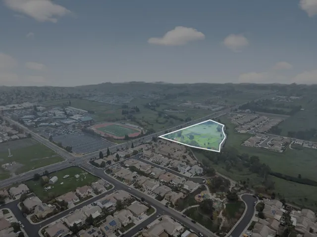 a view of a town with mountains in the background