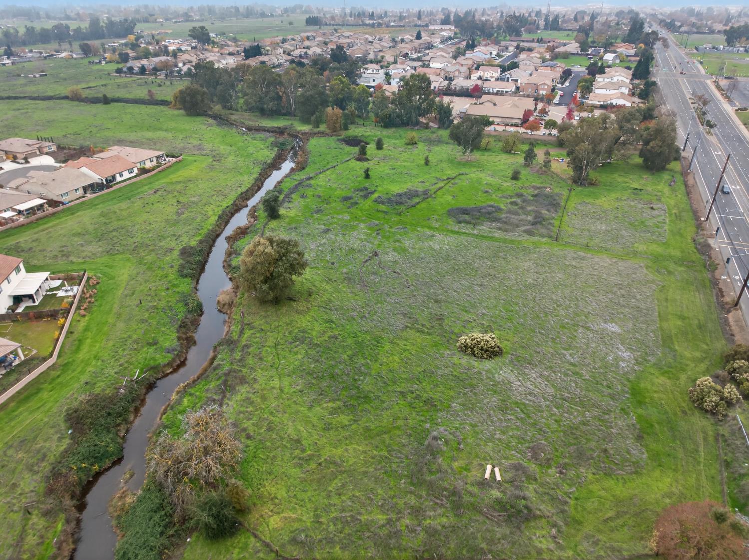 0 Calvine Road Elk Grove, CA 95624 - Photo 22 of 34 an aerial view of huge green field with lots of green plants and covered by side of the house