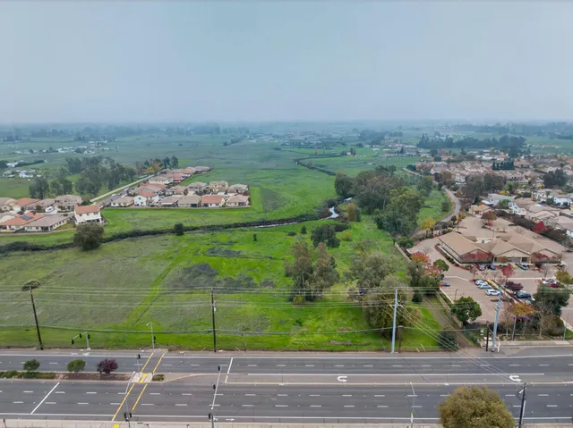 an aerial view of a house with outdoor space