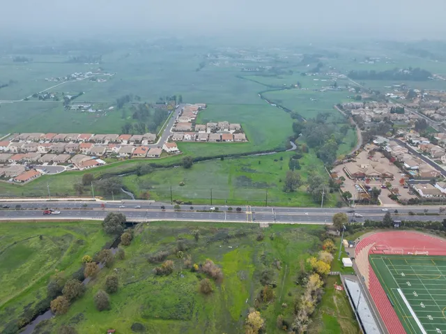 a aerial view of a house with a yard