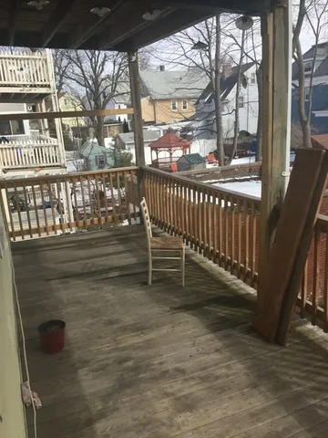 a view of a porch with a bench