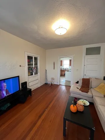 a room with furniture and wooden floor