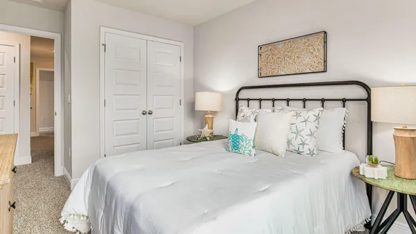 a bedroom with a bed and a view of bathroom