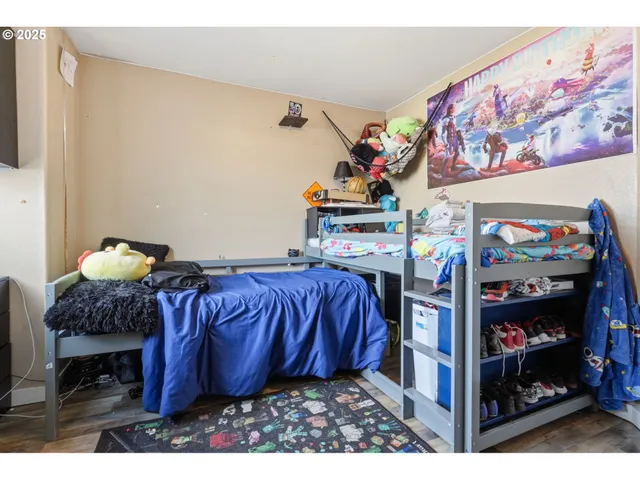 a bed room with a bed and a television