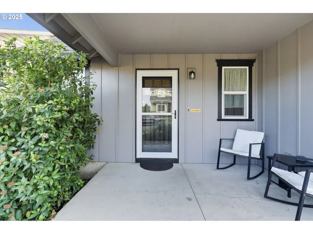 a backyard of a house with outdoor seating