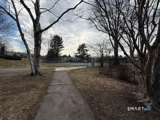 a view of house with a big yard