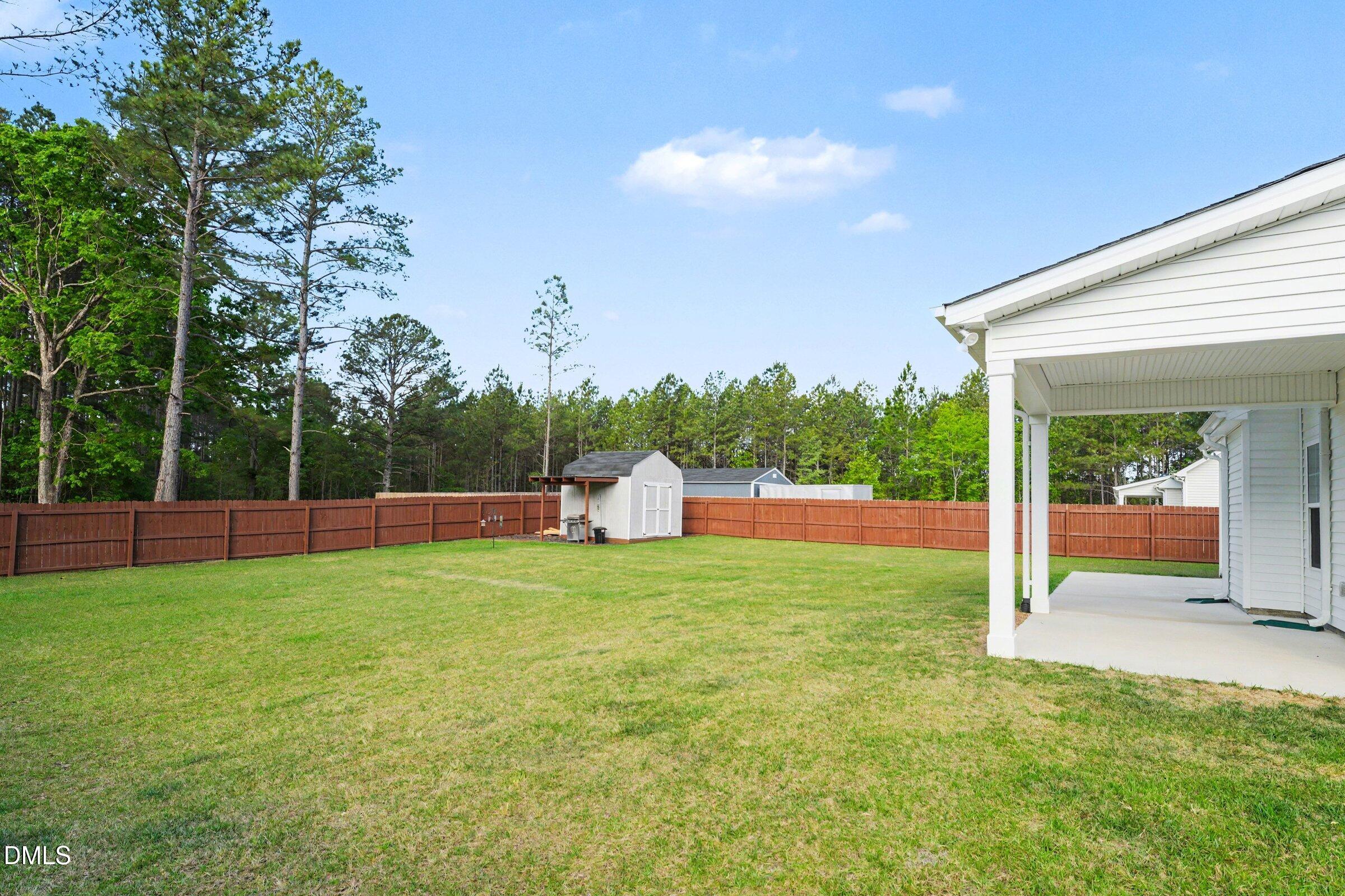2815 Lemuel Black Road Spring Lake, NC 28390 - Photo 16 of 37 a view of a house with backyard and sitting area