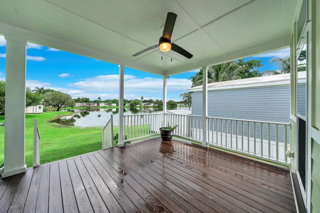 a view of a deck with a big yard and wooden floor