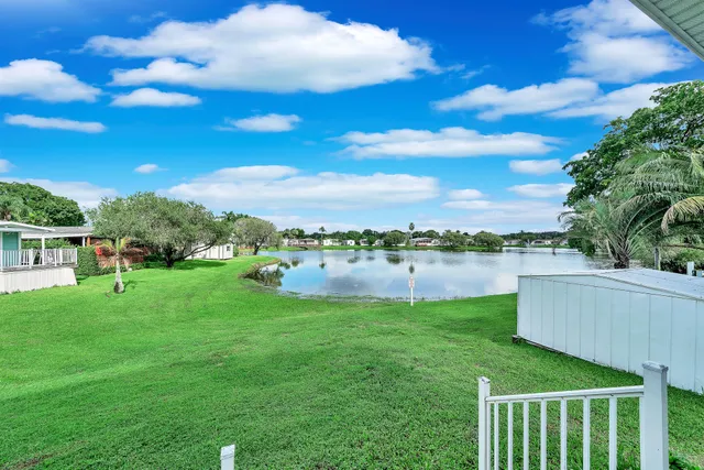 a view of a lake with a garden