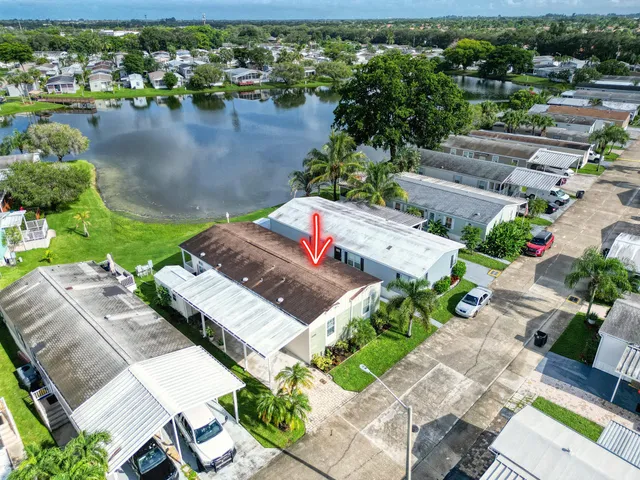 an aerial view of a house with outdoor space