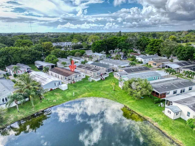 a view of a garden with a lot of trees & houses