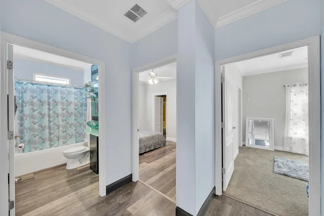 a view of a bathroom with tub and shower