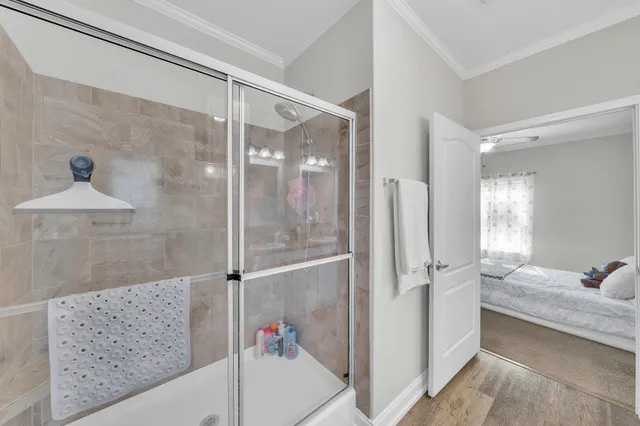 a bathroom with a shower and a sink