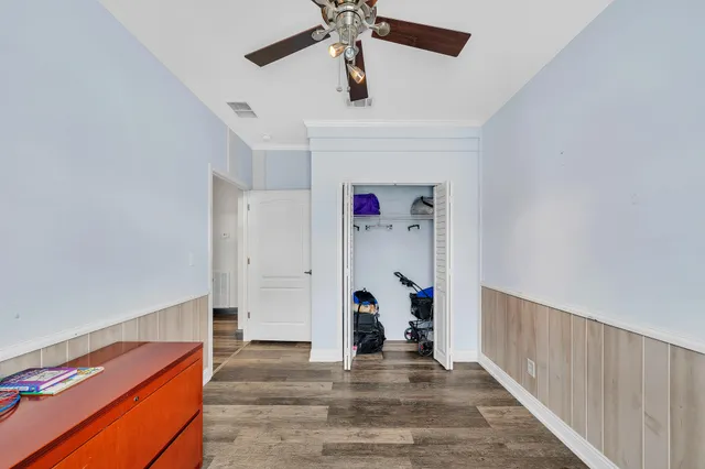 a bathroom with a sink a toilet a mirror and bathtub