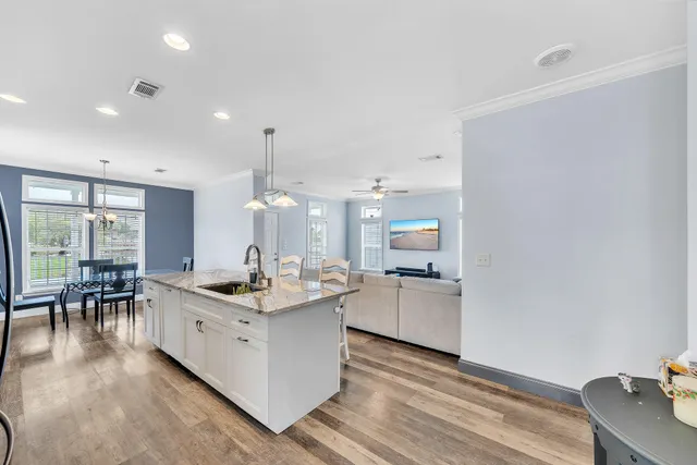 a kitchen with a stove and a white cabinets