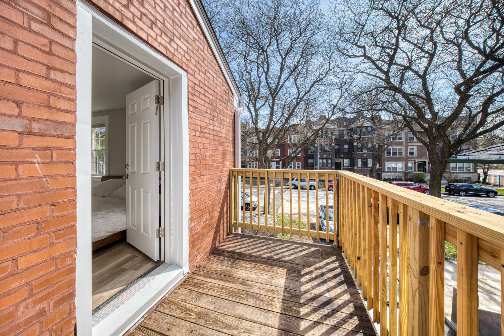 4134 South Michigan Avenue Chicago, IL 60653 - Photo 13 of 20 a view of a wooden balcony with wooden floor and fence
