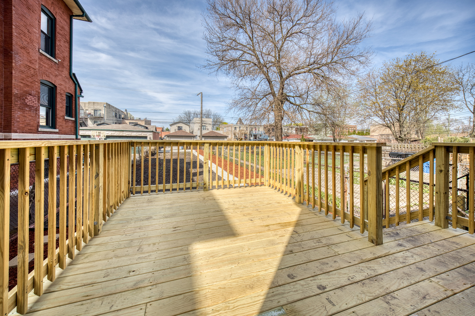 4134 South Michigan Avenue Chicago, IL 60653 - Photo 18 of 20 a view of a balcony with wooden floor