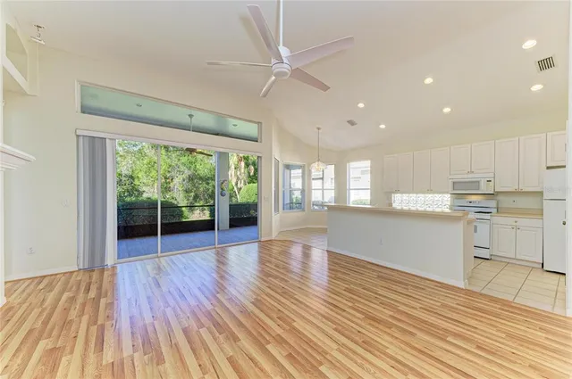 a view of a room with wooden floor and staircase