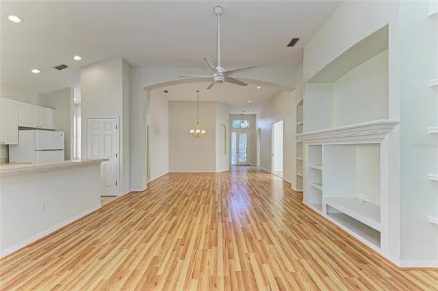 a view of kitchen and kitchen with wooden floor