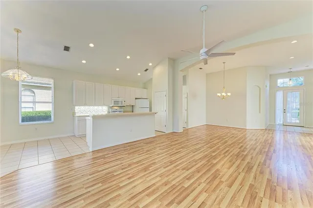 a kitchen with a stove a sink and a refrigerator