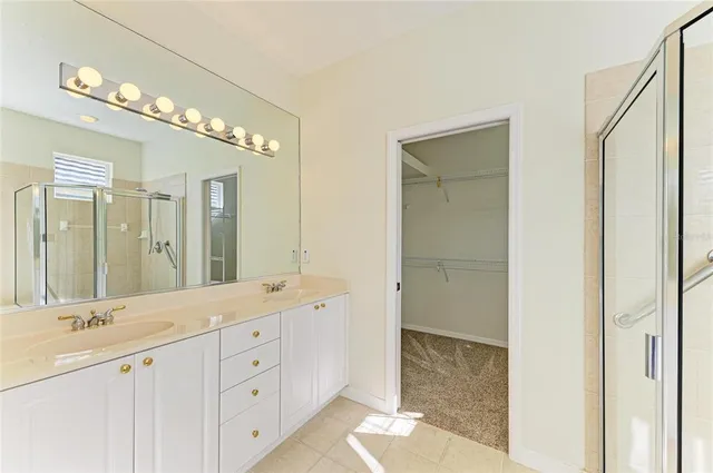 a view of a livingroom with a ceiling fan and window