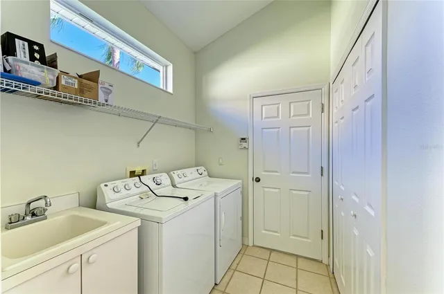 a front view of a house with yard and green space