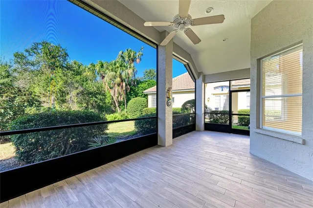 an aerial view of a house with yard