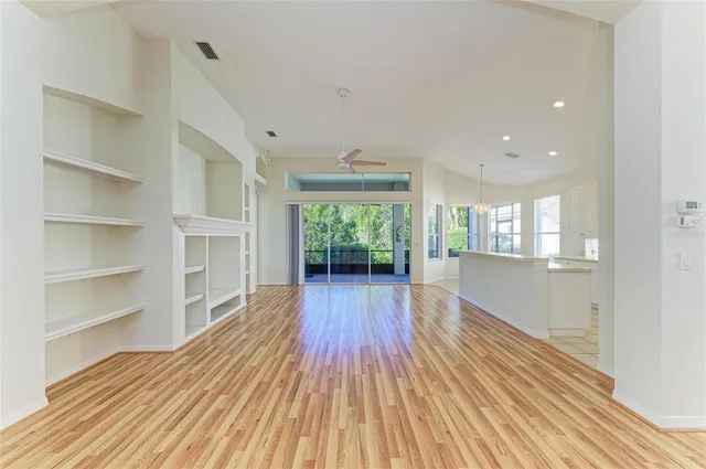 a view of kitchen with wooden floor and window
