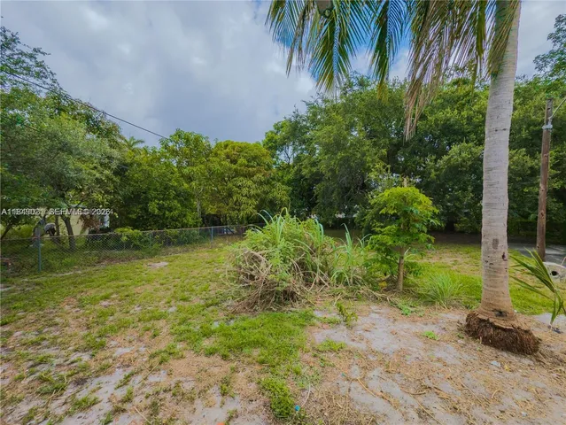 a backyard of a house with lots of green space