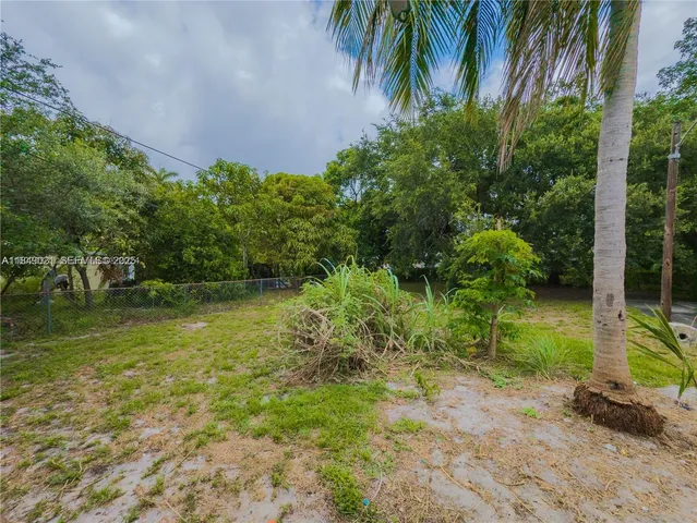 a backyard of a house with lots of green space