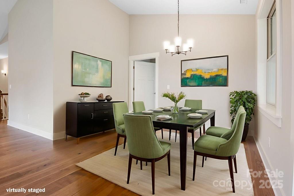 21 Craftsman Overlook Ridge Arden, NC 28704 - Photo 14 of 36 a view of a dining room with furniture and wooden floor