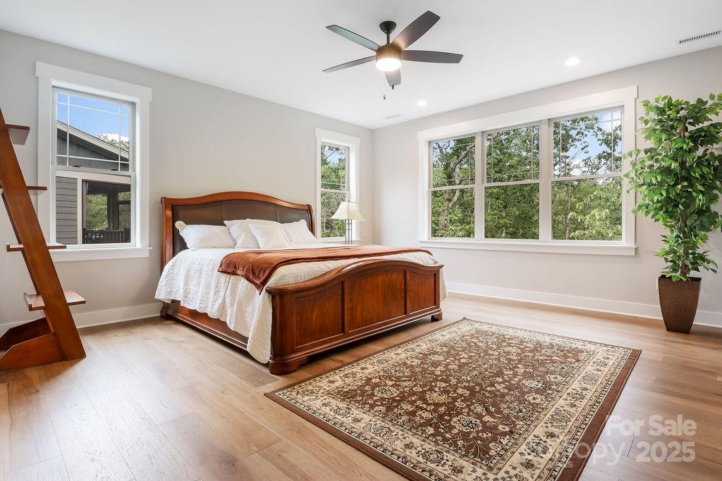 21 Craftsman Overlook Ridge Arden, NC 28704 - Photo 18 of 36 a bed sitting in a spacious bedroom next to a window
