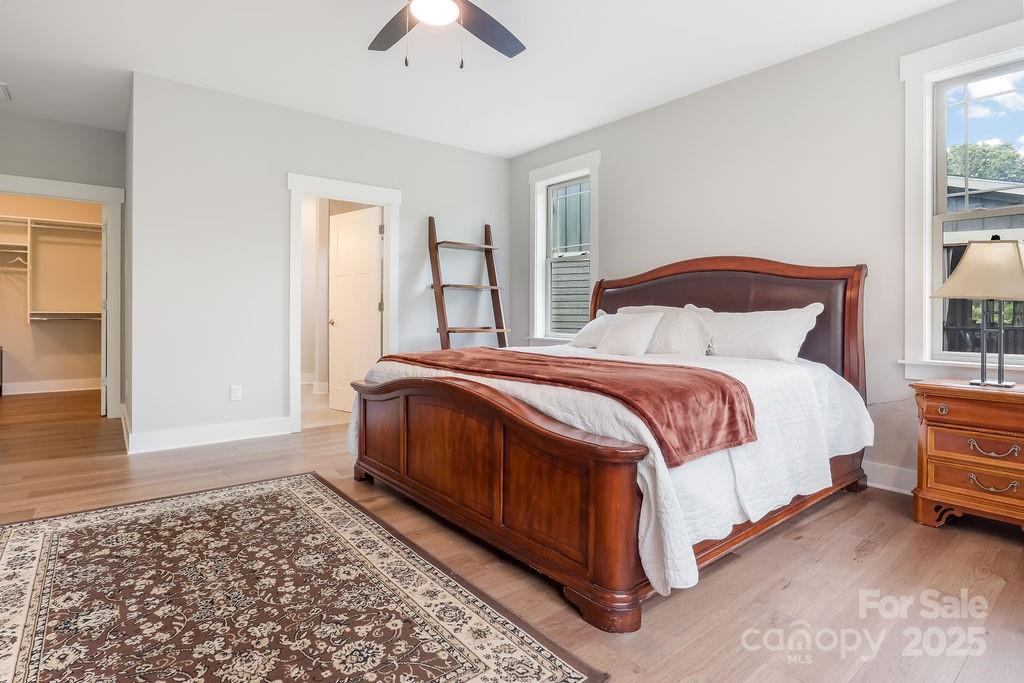21 Craftsman Overlook Ridge Arden, NC 28704 - Photo 20 of 36 a spacious bedroom with a bed and a window