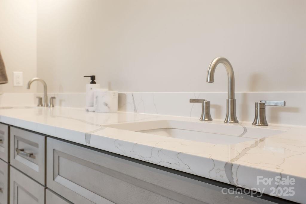 21 Craftsman Overlook Ridge Arden, NC 28704 - Photo 22 of 36 a bathroom with a sink and a mirror