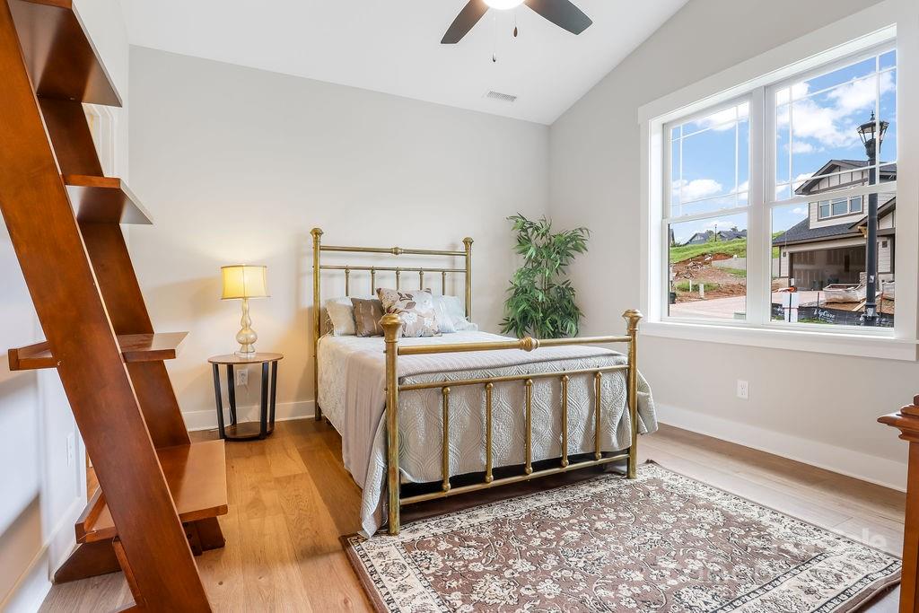 21 Craftsman Overlook Ridge Arden, NC 28704 - Photo 25 of 36 a bed room with furniture and a window