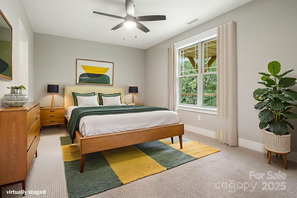 21 Craftsman Overlook Ridge Arden, NC 28704 - Photo 32 of 36 a bedroom with a bed furniture and a potted plant