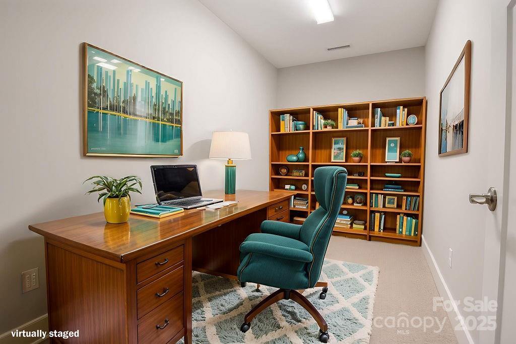 21 Craftsman Overlook Ridge Arden, NC 28704 - Photo 33 of 36 a view of a workspace with furniture and a bookshelf