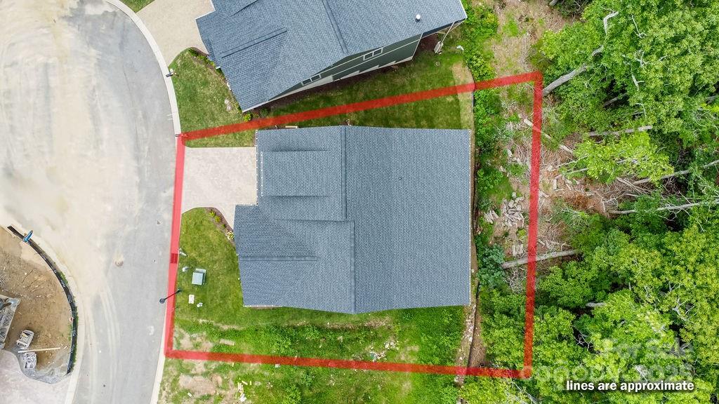 21 Craftsman Overlook Ridge Arden, NC 28704 - Photo 36 of 36 a backyard of a house with lots of green space