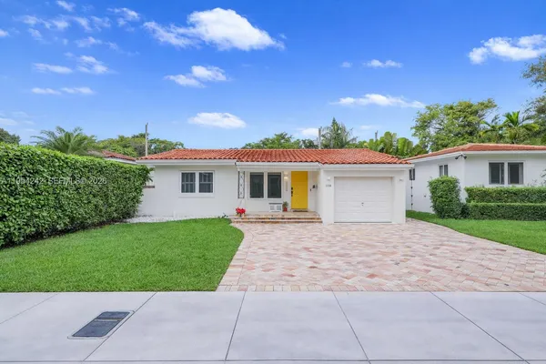 a view of a house with a yard