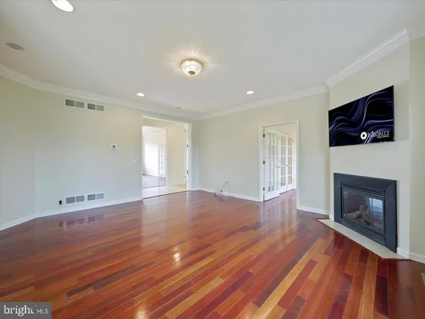 a large room with a large window and kitchen view